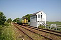 Blotoft signal box (Helpringham)with a Class 153 unit passing.[38]