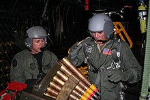 Ermey loading ammunition for the Bofors 40 mm gun aboard a  Lockheed AC-130H Spectre Gunship in 2006