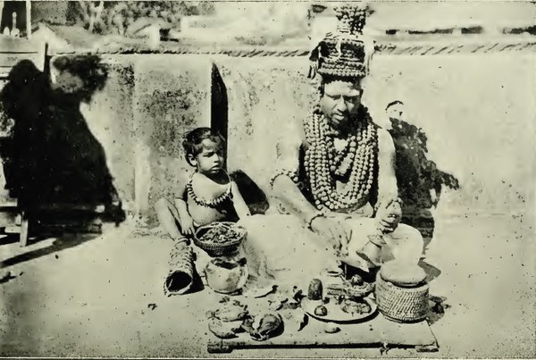 A Tamil Smartha Brahmin holy man engaged in Siva-worship. His body is covered by coat and chains made of Rudrāksha beads