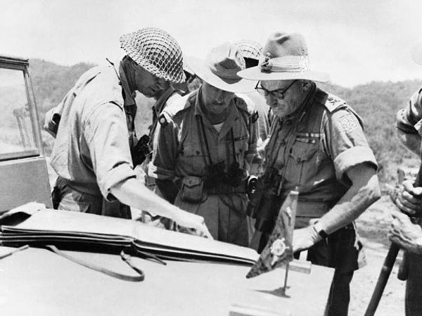 General Sir Montagu Stopford, GOC XXXIII Indian Corps (right), confers with Major General J M L Grover, GOC 2nd Division (left) and Brigadier J A Salo
