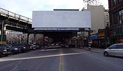 Remains of the Broadway Ferry spur behind the billboard Broadway Ferry spur vc.jpg