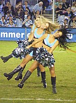 Cheerleaders cheering on the crowd at Endeavour Field. CRONULLA RUGBY LEAGUE CHEERGIRLS (3440920272).jpg