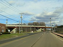 A lengthy bridge carries the busway over East Street (pictured) and Allen Street in New Britain CTfastrak bridge over East Street, December 2014.JPG