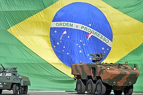 VBTP-MR Guarani armed with a Remax during the Ceremony to commemorate the 71 years of the Taking of Monte Castelo next to it an M8 Greyhound used in Italy.