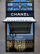 Chanel's headquarters storefront window at the Place Vendôme Paris with awning