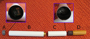 Disassembled parts of a first-generation e-cigarette. A. Light-emitting diode light cover B. battery (also houses circuitry) C. atomizer (heating element) D. cartridge (mouthpiece)