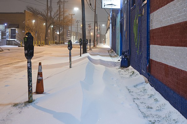 Deep Ellum sidewalk covered with snow during the mid-February 2021 winter storm