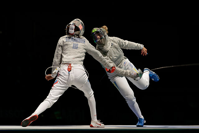 Kharlan (R) scores against Russian Dina Galiakbarova in the women's team sabre final of the 2013 World Championships