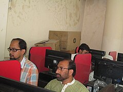 People glued to computers during the Urdu Wikipedia Workshop