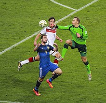 Higuaín challenging Germany's Mats Hummels and Manuel Neuer in the 2014 World Cup Final