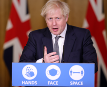 Boris Johnson with the "Hands, Face, Space" slogan introduced in September Hands, Face, Space (Johnson press conference).png