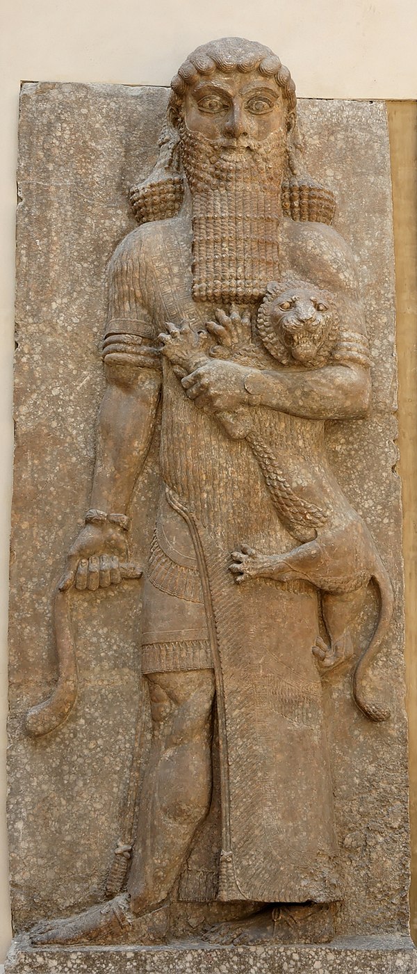 Possible representation of Gilgamesh as Master of Animals, grasping a lion in his left arm and snake in his right hand, in an Assyrian palace relief (