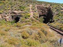 Eastern portals, 1876 tunnel at left, 1929 tunnel at right Hex River railpass tunnels east.JPG