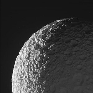 A high-relief image of Mimas by Cassini on January 30, 2017. [43] The shapes and the texture of its many overlapping craters can clearly be seen.