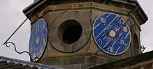 Vita in motu on one of the sundials (right) at Houghton Hall, Norfolk, England Houghton Hall Norfolk UK 4-face sundial.jpg