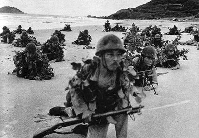 Soldiers of the 5th division landing on a beach during the Malayan invasion, December 1941