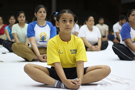 A girl student doing yoga on International Yoga Day at Panjab University, Chandigarh (India); click by Vikash Kinha