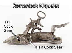 With the Italian or Roman style miquelet lock, the mainspring pushes down on the toe of the hammer and the sears engaged the hammer on both the toe and heel. Italian Style Miquelet Lock, AKA Romanlock.jpg