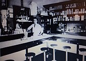 Interior of chili parlor with deli-style stools at a counter