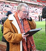 Football commentator John Motson got his first car coat in 1972, subsequently having them tailored in Savile Row John Motson.jpg