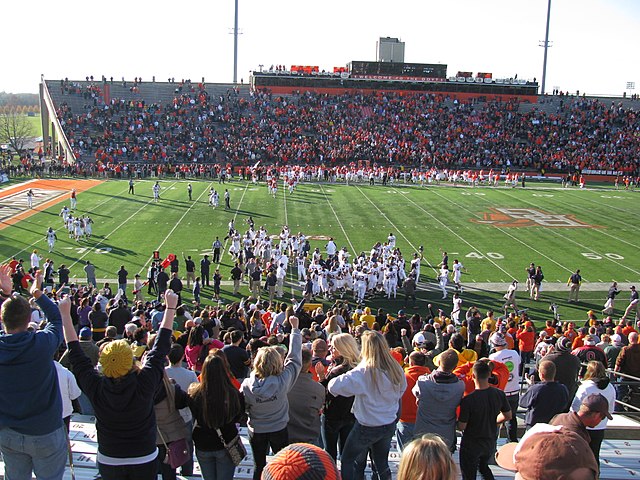 Kent State players and fans celebrate near the end of the Flashes 31–24 victory over the Falcons at Doyt Perry Stadium that clinched the 2012 MAC East