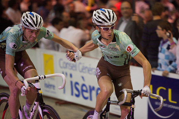 One racer propels his partner like a slingshot during a Madison race