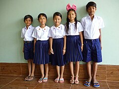 children standing and lokking towards camera