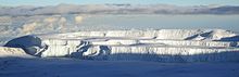 A glacier on Mount Kilimanjaro. The oldest now present ice of Kilimanjaro formed during the African humid period KiliGlacier.JPG