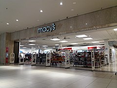 Lower level mall entrance of Macy's. A label scar of Bamberger's is visible behind the sign
