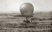 Contemporary image of a tethered, round observaton balloon being prepared for use