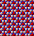 View of trioctahedral sheet structure of mica. The binding sites for apical oxygen are shown as white spheres.
