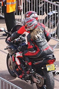 Motorcycle rider and passenger in leathers on Suzuki Bandit at Ace Cafe.jpg