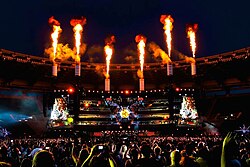 Muse performing "Supremacy" at Stadio Olimpico, Rome on 6 July 2013 during The Unsustainable Tour. Rolling Stone stated the band possess "stadium-crushing songs". Muse - Supremacy - Roma.jpg