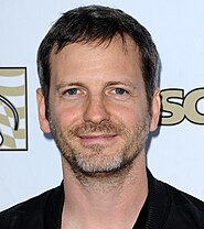 Dr. Luke co-wrote the song and produced it under the pseudonym Tyson Trax. Music-dr-luke.jpg