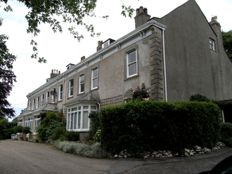 New Raleigh House, built after 1745 by Nicholas Hooper on ground immediately above the site of the ancient manor house of the Chichesters, reported as in ruins in 1745 NewRaleighHouse Pilton Devon.PNG