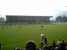 The main stand at the Victoria Stadium NorthwichLincolnFACup2009.JPG