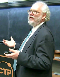 Peter Shor (pictured here in 2017) showed in 1994 that a scalable quantum computer would be able to break RSA encryption. Peter Shor 2017 Dirac Medal Award Ceremony.png