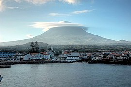 View off the coast of Madalena parish, showing the stratovolcano Pico and settlement of the municipal seat