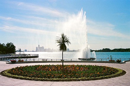The Peace Fountain in Windsor's Reaume Park/Coventry Gardens facing west-northwest across the Pillette "Dock" and Detroit River to Belle Isle and a distant Detroit skyline.