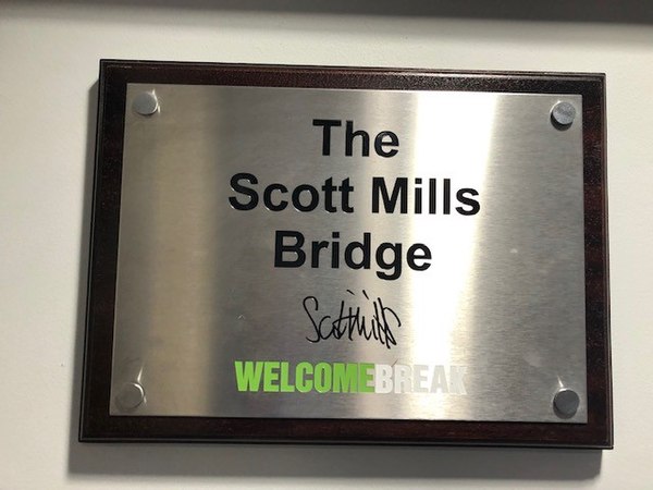 Plaque naming the Scott Mills Bridge