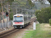 A2 Set 47 accelerates out of Success Hill en route to Midland on dual gauge track.