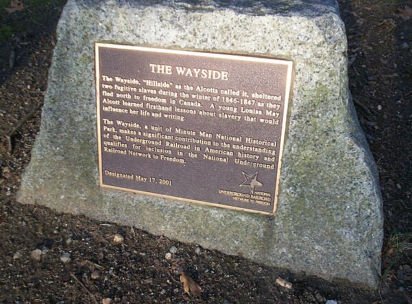 A plaque recognizes the role the Alcott family played as part of the Underground Railroad while living in this house.