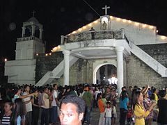 Faithful Catholics of Banate waiting their turn to venerate the Santo Entierro after the Good Friday procession.