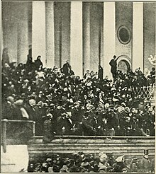 Alexander Gardner took this photo during Lincoln's second inaugural address; Johnson, sworn in earlier in the day, is the individual seated in the front row, far right, holding his hat over his face The photographic history of the civil war.. (1911) (14782644103).jpg