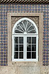 Moorish tiles surrounding a large arch window at Palácio Nacional da Pena