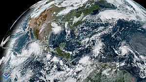 Six simultaneous tropical cyclones in the Eastern Pacific and North Atlantic on September 19. From left to right: Kiko, Mario, Lorena, Imelda, Humberto and Jerry Tropical Activity is Ramping Up This September (48760316027).jpg