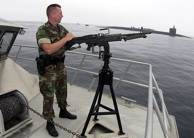 File:US Navy 040714-N-8977L-012 Master-at-Arms 3rd Class Rick Bolander of Marquette, Mich., mans a 7.62mm M-60 machine gun aboard the patrol catamaran Defender One.jpg