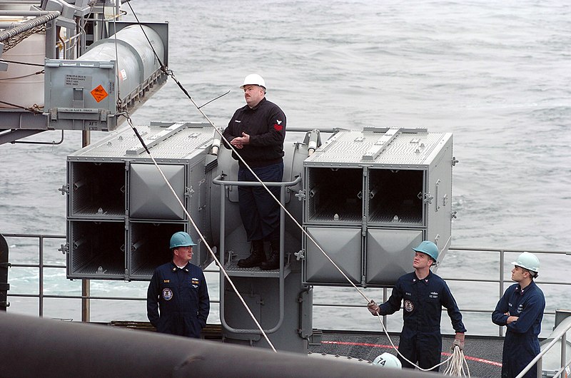 File:US Navy 060606-N-9723W-035 A Sailor stabilizes a RIM-7 NATO Sea Sparrow missile container as it is lowered from the flight deck aboard the Nimitz-class aircraft carrier USS John c. Stennis (CVN 74).jpg