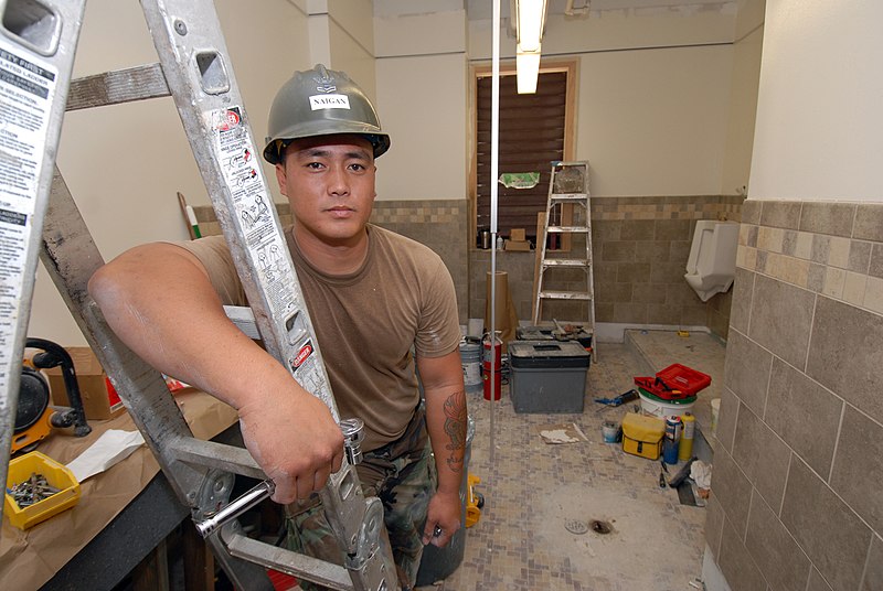 File:US Navy 070315-N-4965F-003 Utilitiesman 2nd Class Darwin Naigan, assigned to Naval Facilities Engineering Command, Hawaii (NAVFAC), takes a break during renovations to a male head at Naval Station Pearl Harbor.jpg