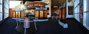 An exhibit of the Volunteers football team's accomplishments at Neyland-Thompson Sports Center. The AFCA National Championship Trophy is on show in the display case University of Tennessee exhibit.jpg
